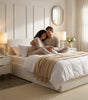 The Hampstead white boucle ottoman storage bed with gas-lift base open showing 610 litre storage – Comfort Crest