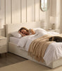 The Hampstead white boucle ottoman storage bed with gas-lift base open showing 610 litre storage – Comfort Crest