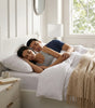 The Hampstead white boucle ottoman storage bed with gas-lift base open showing 610 litre storage – Comfort Crest