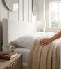 The Hampstead white boucle ottoman storage bed with gas-lift base open showing 610 litre storage – Comfort Crest
