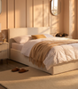 The Hampstead white boucle ottoman storage bed with gas-lift base open showing 610 litre storage – Comfort Crest